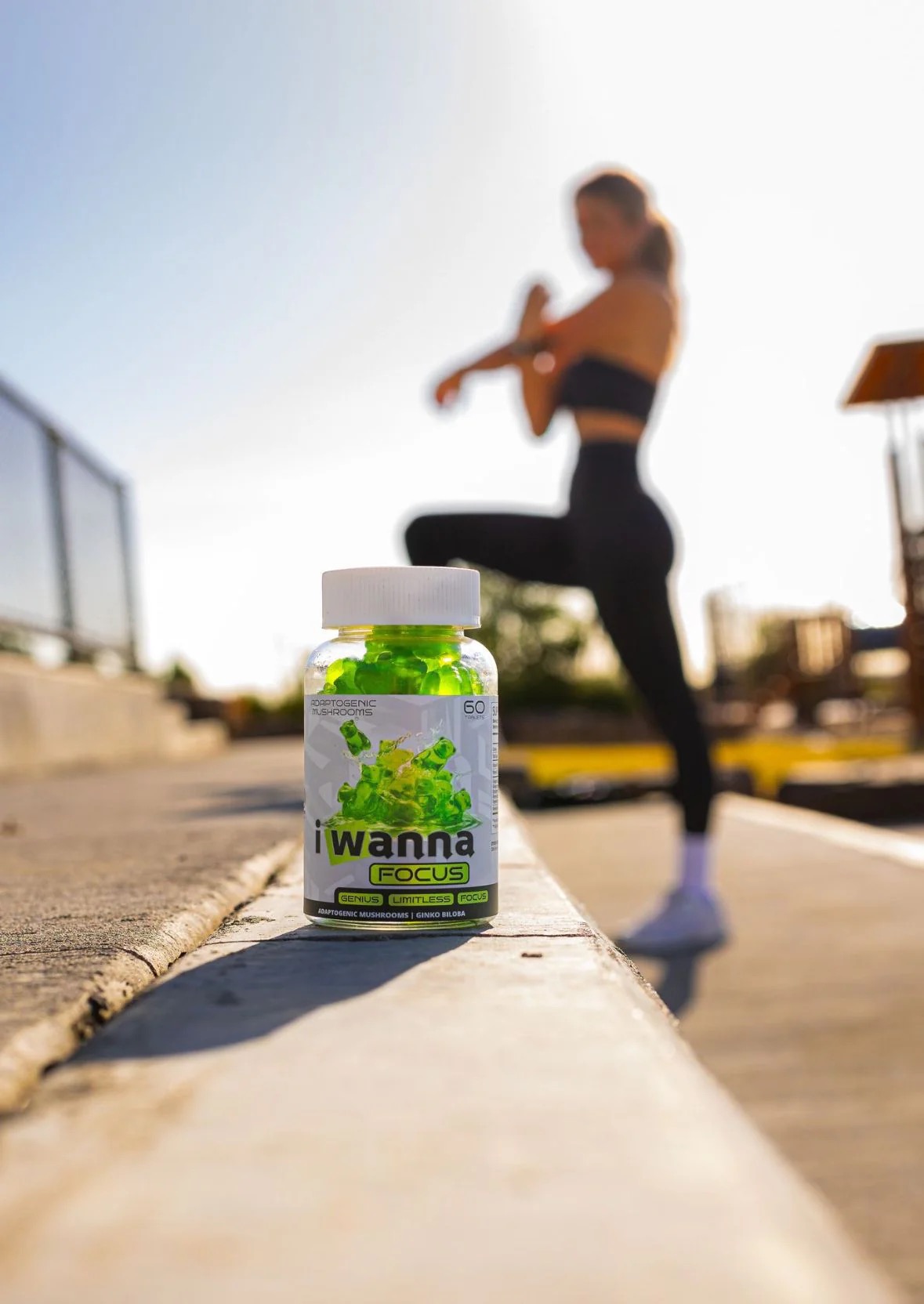 Focus bottle outdoors in soft sunlight